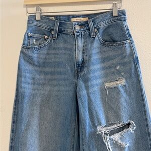 Levi’s baggy dad jeans with slight rips. W24